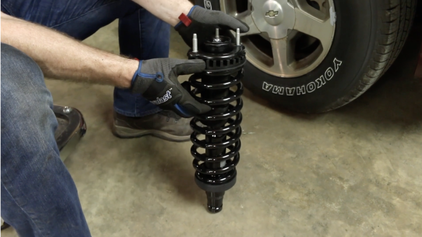 Person showing off a new Duralast loaded strut