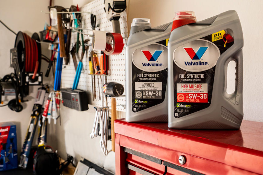 two jugs of Valvoline full synthetic motor oil sitting atop a red toolbox