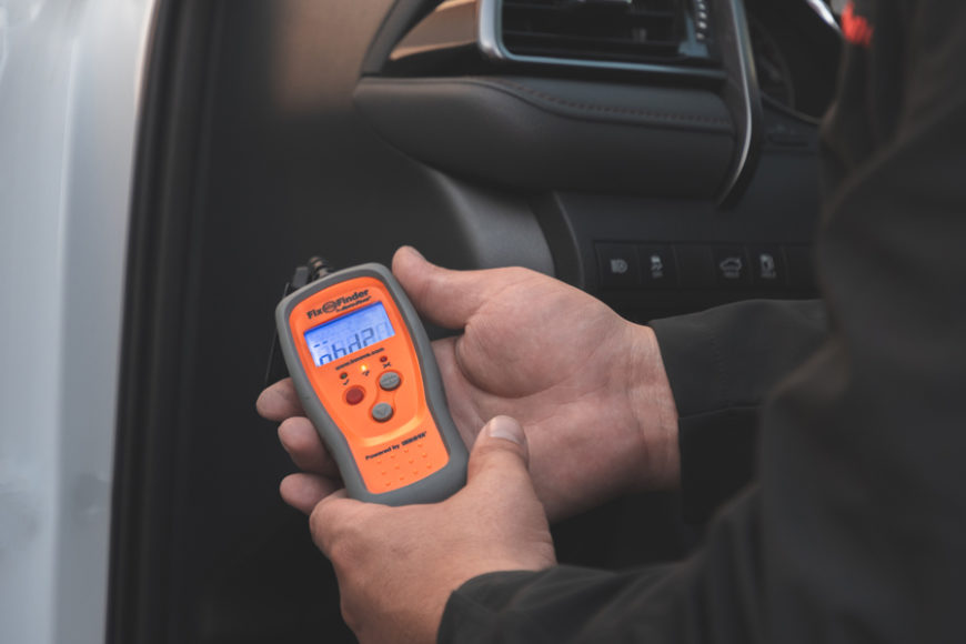 AutoZone associate using a Fix Finder scan tool to diagnose P0017