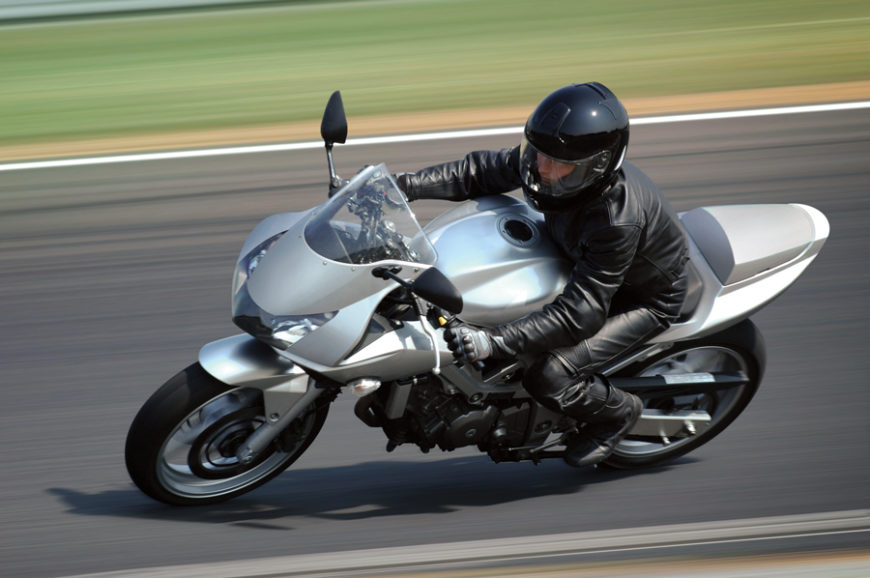 man riding his motorcycle round in circles while considering 
