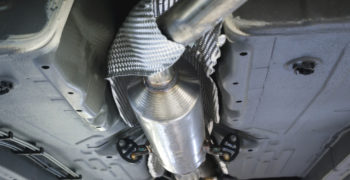 Undercar view of catalytic converter and corrugated heatshield