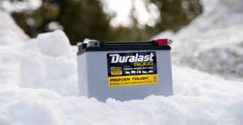 Duralast gold power sport battery close up in snow