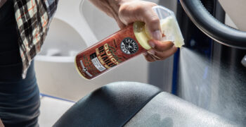 chemical guys leather quick detailer being sprayed on seat