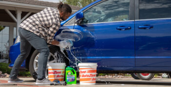 turtle wax max power car wash between 2 az buckets with man washing van